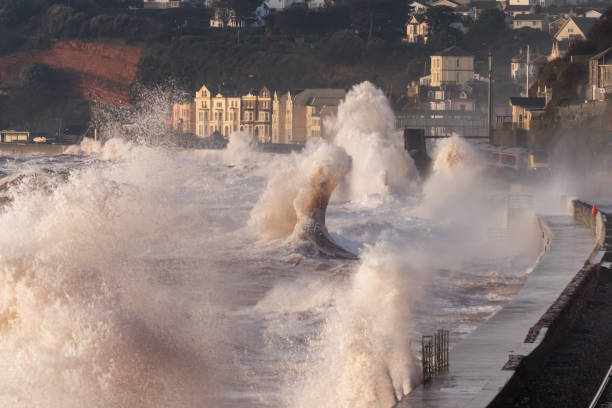 istock Train leaving Dawlish station in a storm for a soaking 645758012