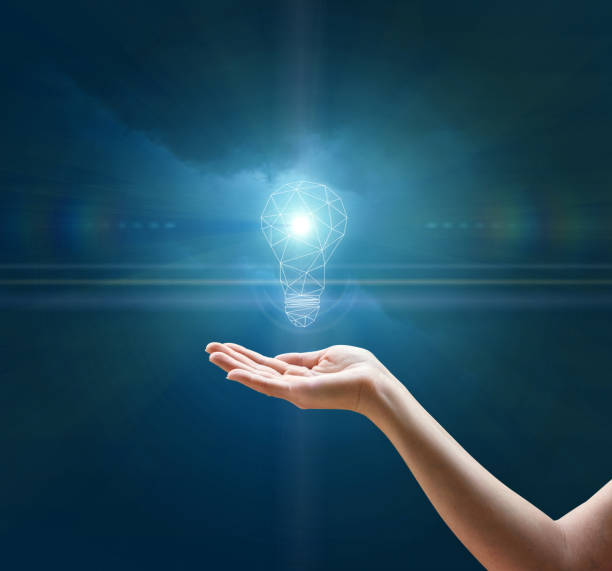 istock Light bulb in hand businesswoman. 645758512