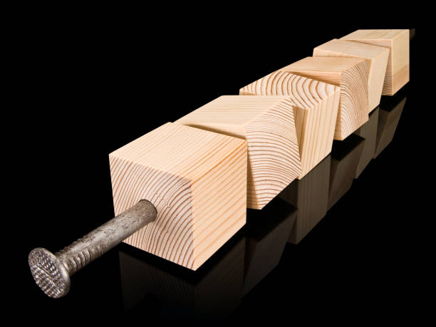 istock Wooden cubes strung on a steel nail 645760840