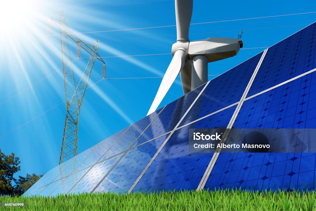 Solar Panels - Wind Turbine - Power Line Group of solar panels with a wind turbine and a power line on a clear blue sky with sun rays. Solar and wind energy Wind Stock Photo