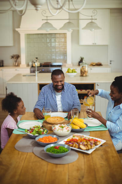 istock Family having meal on dinning table at home 645761426
