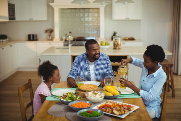 istock Family having meal on dinning table at home 645761448