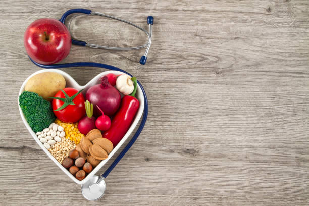 istock Healthy Foods with Stethoscope on Wood Background 645761464