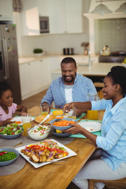 istock Family having meal on dinning table at home 645761548