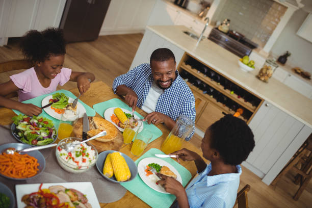 istock Family having meal on dinning table at home 645761608