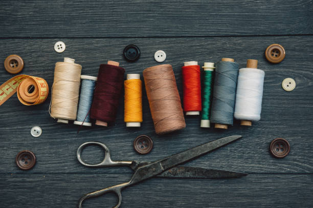Sewing items in tailor shop from above