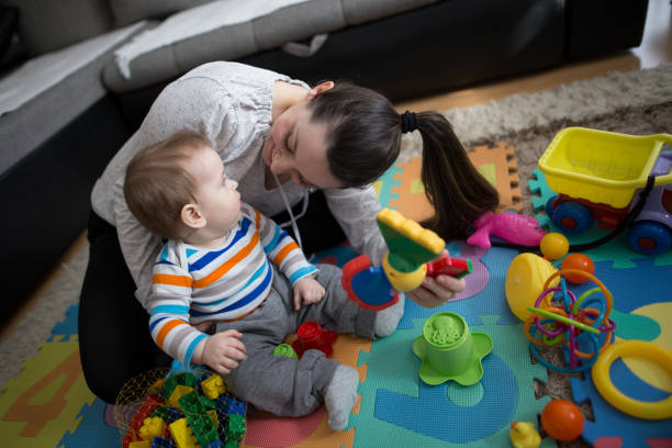 istock Mother playing with baby boy 645770978