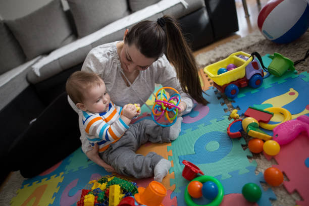 istock Mother playing with baby boy 645773628