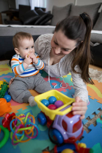 istock Mother playing with baby boy 645773764