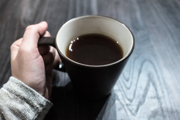 istock Woman hands hold a cup of tea 645773786