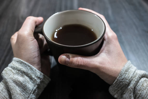 istock Woman hands hold a cup of tea 645773790