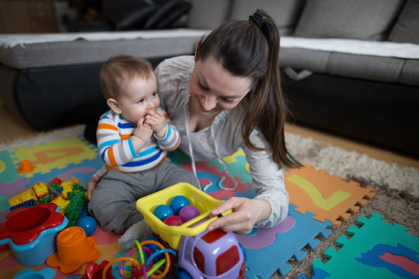 istock Mother playing with baby boy 645773840