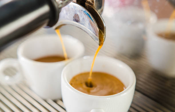 istock Barista making a cup of coffee soft focus image . 645774382