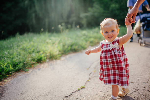 istock woman with a child on a walk on a sunny day 645776520