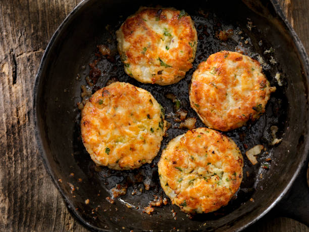 istock Crispy Golden Fish Cakes in a Cast Iron Skillet 645781222