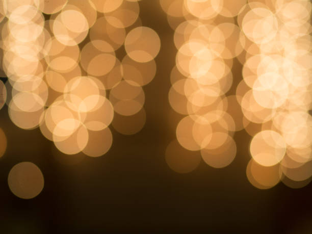 istock Out of focus gold bubble lights 645784412