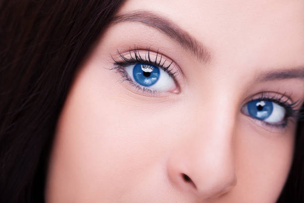 Portrait of woman with blue eyes and black hair