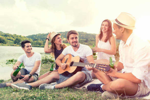 istock Happy Young people having party outdoor 645798728