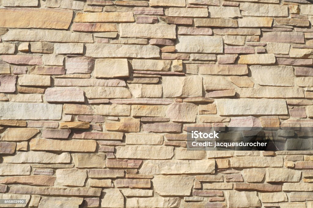 beige stone wall bricks surface texture pattern stone wall brick texture background beige surface facade Architecture Stock Photo