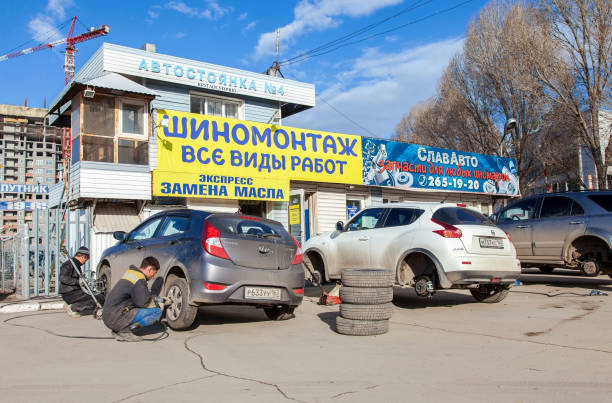SAMARA, RUSSIA - APRIL 11, 2015: Mass replacement of automobile wheels winter to summer