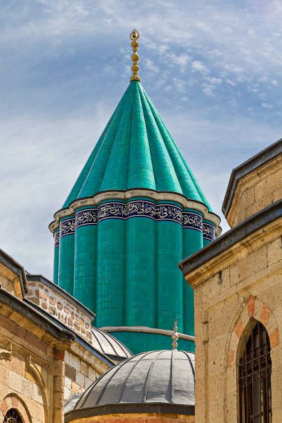 Konya, Turkey - May 20, 2014: View over the green dome of the Mausoleum of Mevlana in Konya, Turkey. Green dome of the Mausoleum of Mevlana against the blue sky in Konya, Turkey. konya stock pictures, royalty-free photos & images