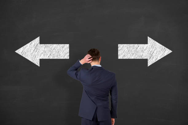 istock Indecisive, disorientated and bewildered man stressed with headache over decision making 645813744