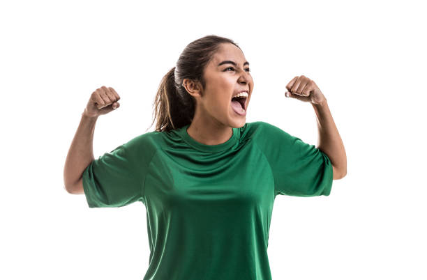 Soccer woman celebrating on green uniform isolated on white background Sport collection cheering stock pictures, royalty-free photos & images