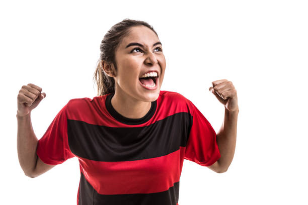 istock Soccer woman on red uniform celebrating on white background 645813848
