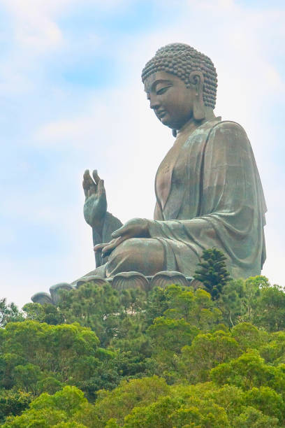 Big Buddha closeup statue in Hong Kong Big Buddha closeup statue, Hong Kong on cloudy sky background tian tan buddha stock pictures, royalty-free photos & images