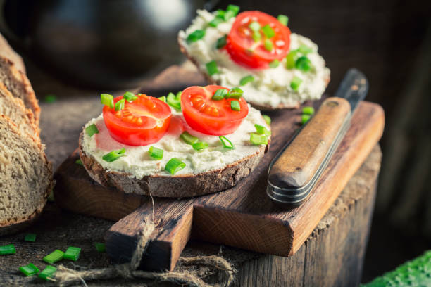 istock Tasty sandwich with fromage cheese, cherry tomatoes and chive 645814986