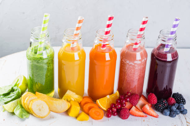 istock Selection of colourful smoothies on rustic wood background 645815114