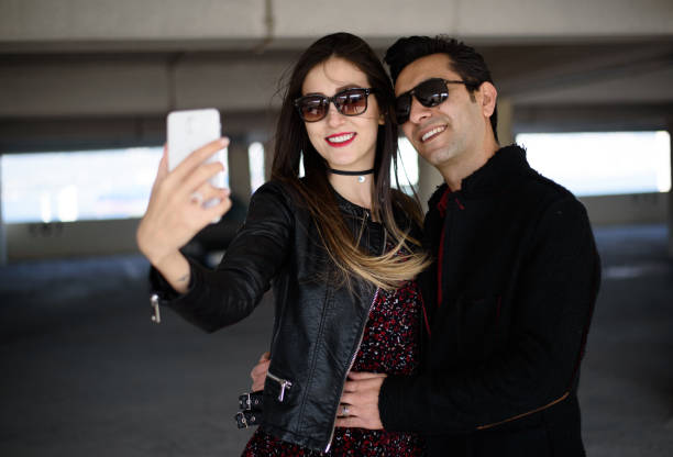 istock Young happy couple taking a selfie with smartphone 645815704