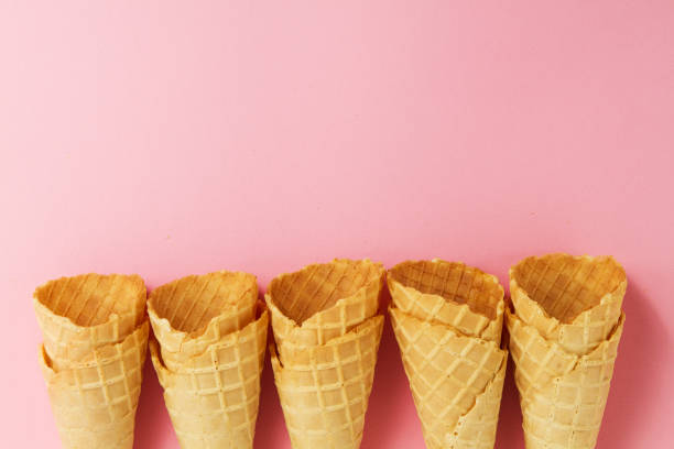 istock Empty Colorful Pastel Toning Ice Cream Cones on Pink Background. 645818718