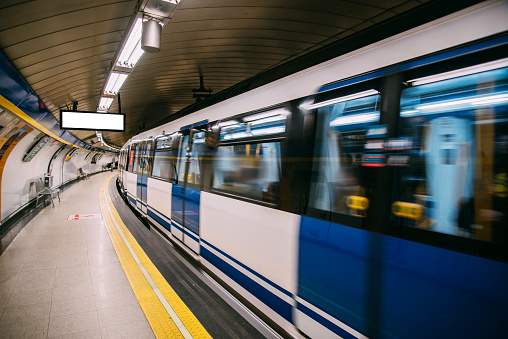 An underground train in motion in Madrid, Spain.