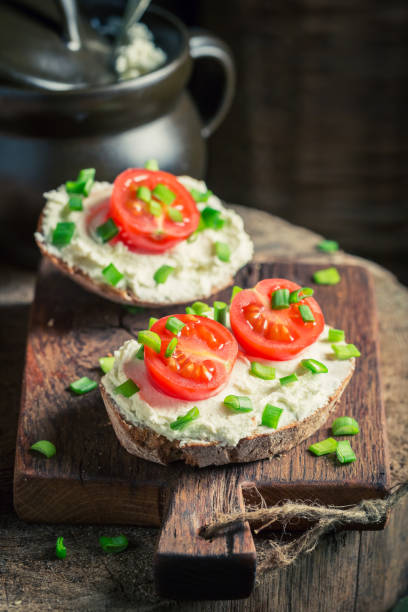 istock Tasty sandwich with fromage cheese, chive and cherry tomatoes 645821652