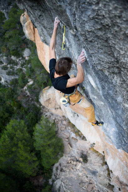 istock Extreme sport climbing. Rock climber. 645830094