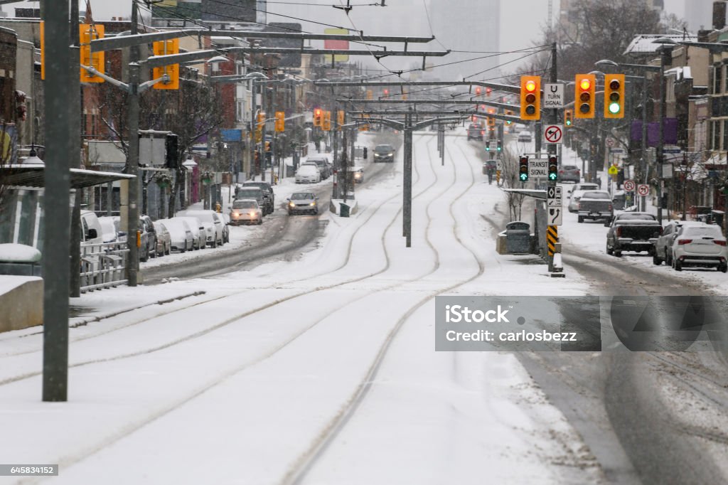 snow street looking down a road full os snow on winter in toronto Blizzard Stock Photo