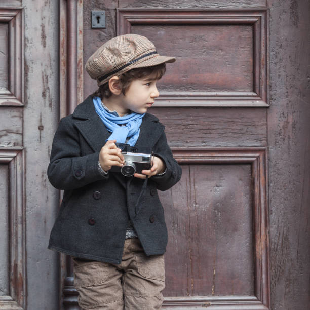 Portrait Of Little Boy Posing With His Camera