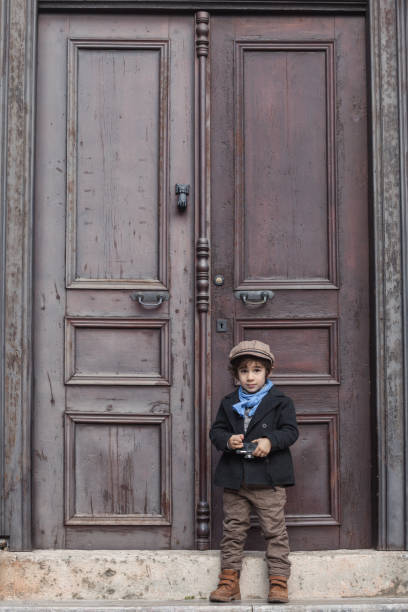 istock Portrait Of Little Boy Posing With His Camera 645837056
