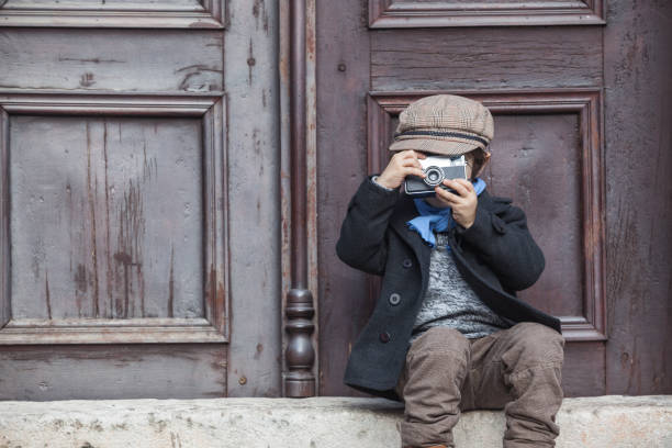 istock Portrait Of Little Boy Posing With His Camera 645837128