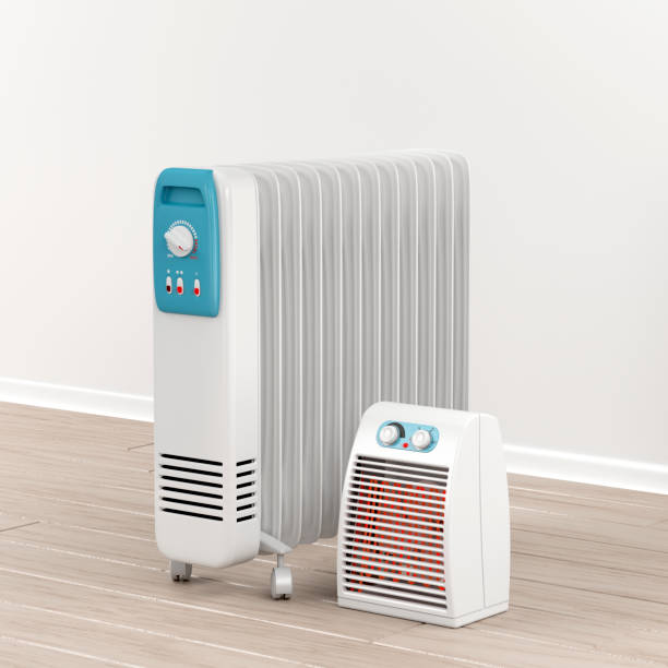 istock Oil-filled radiator and fan heater 645837228