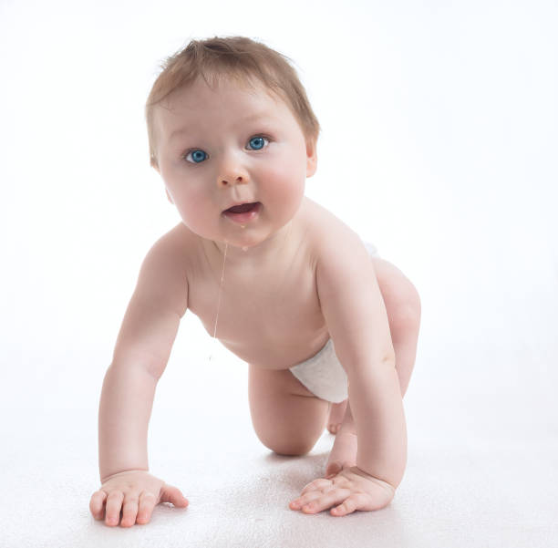 istock Slobbery little baby crawling 645837894