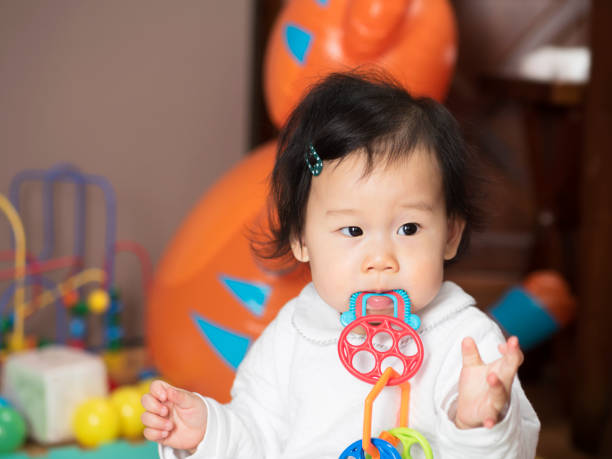 istock baby girl bite teething ring 645838898