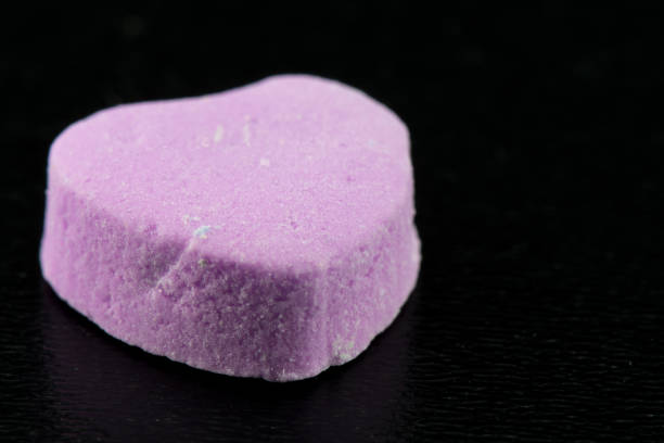 Angle View of Blank Purple Candy Heart on Black Background