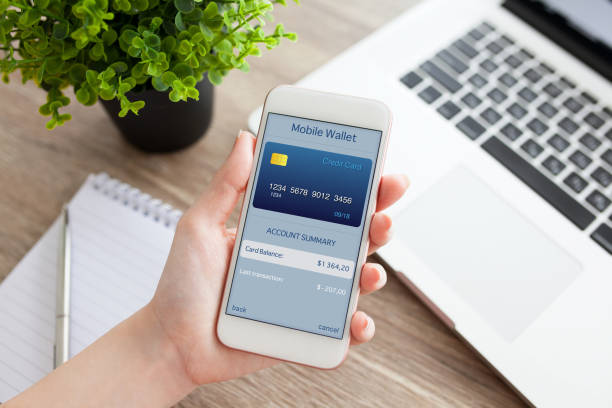 istock female hand holding phone with app mobile wallet on screen 645841134
