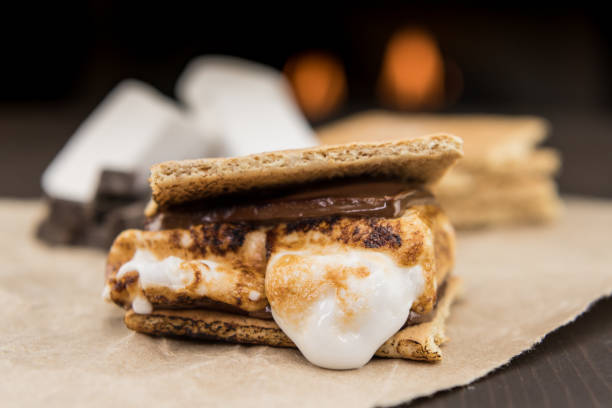 Assembled Smore on Brown Paper Assembled Smore on Brown Paper in front of fire smore photos stock pictures, royalty-free photos & images