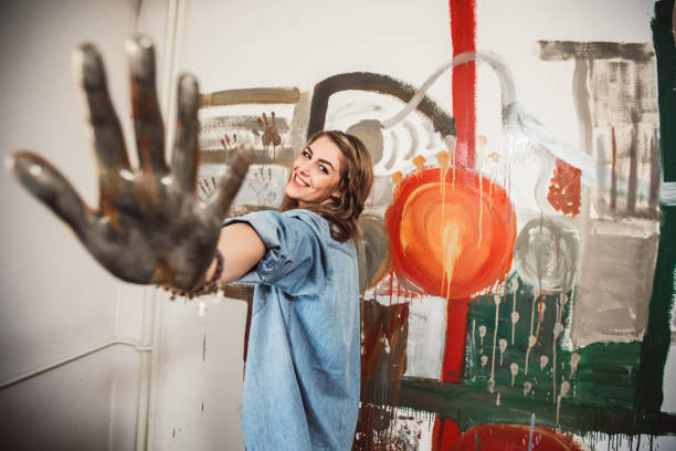 istock Girl painting with hands 645843718