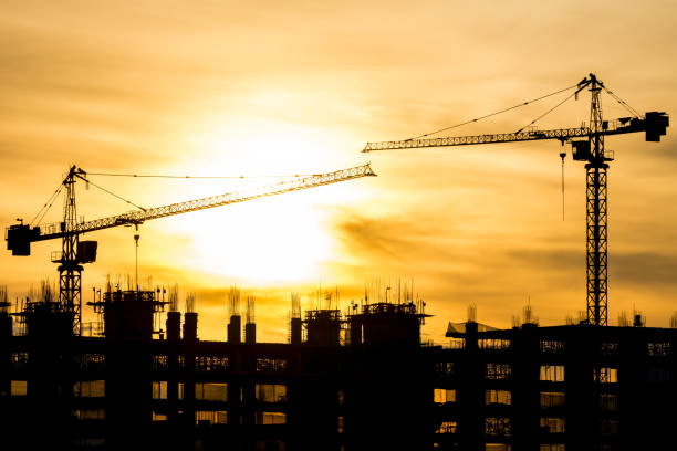 istock Silhouette of building and construction crane 645844034
