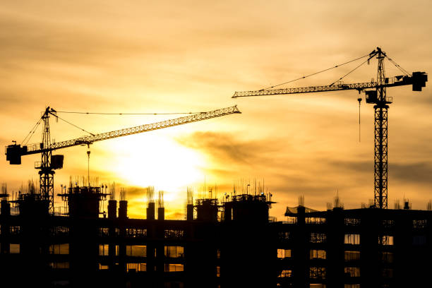 istock Silhouette of building and construction crane 645844042