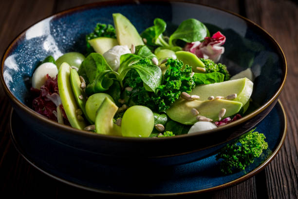 istock Fresh kale salad with avocado, lettuce and grape 645844940